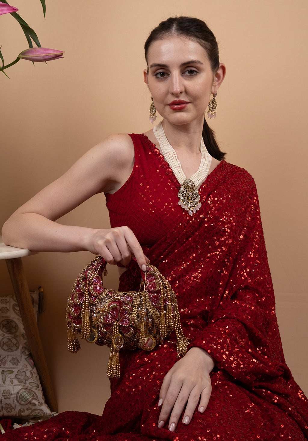 Red beaded floral mirror work clutch bag with handcrafted detailing and suede inner lining for wedding and festive wear
