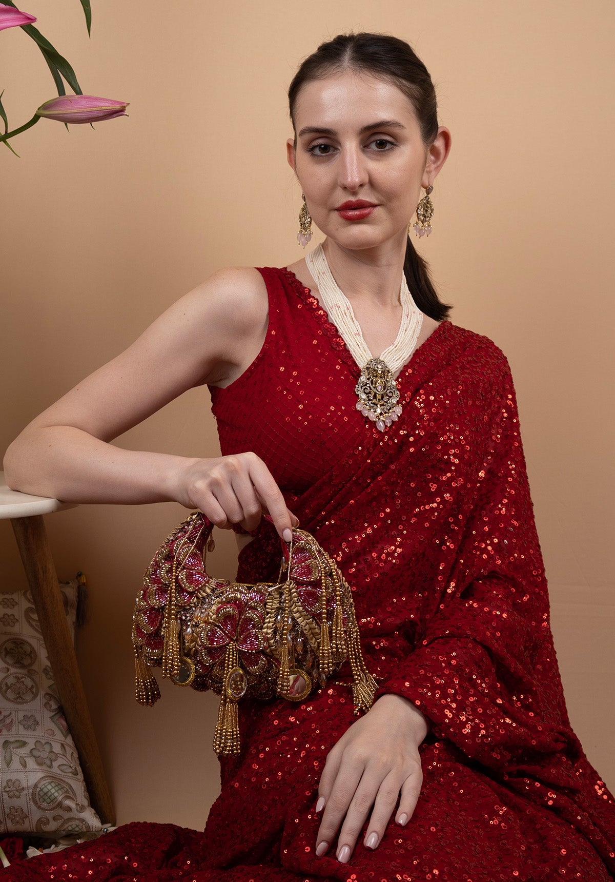 Red beaded floral mirror work clutch bag with handcrafted detailing and suede inner lining for wedding and festive wear