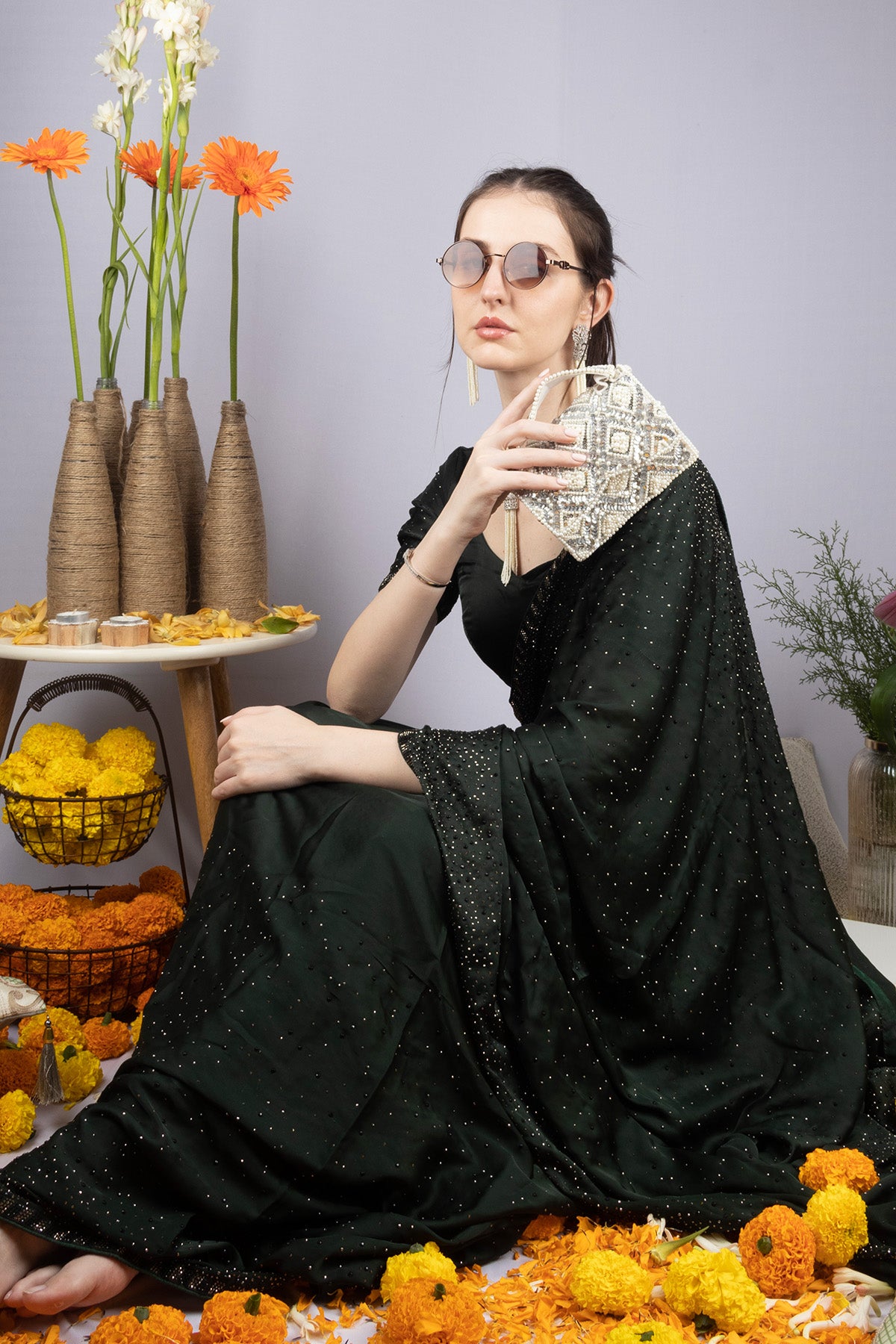 Handcrafted clutch with pearl and sequin geometric embellishment structured design short handle and detachable shoulder chain for wedding and festive wear