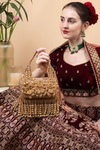 Gold handcrafted evening handbag with Cut Dana floral embroidery, pearl and bead detailing with tassels for wedding and festive wear