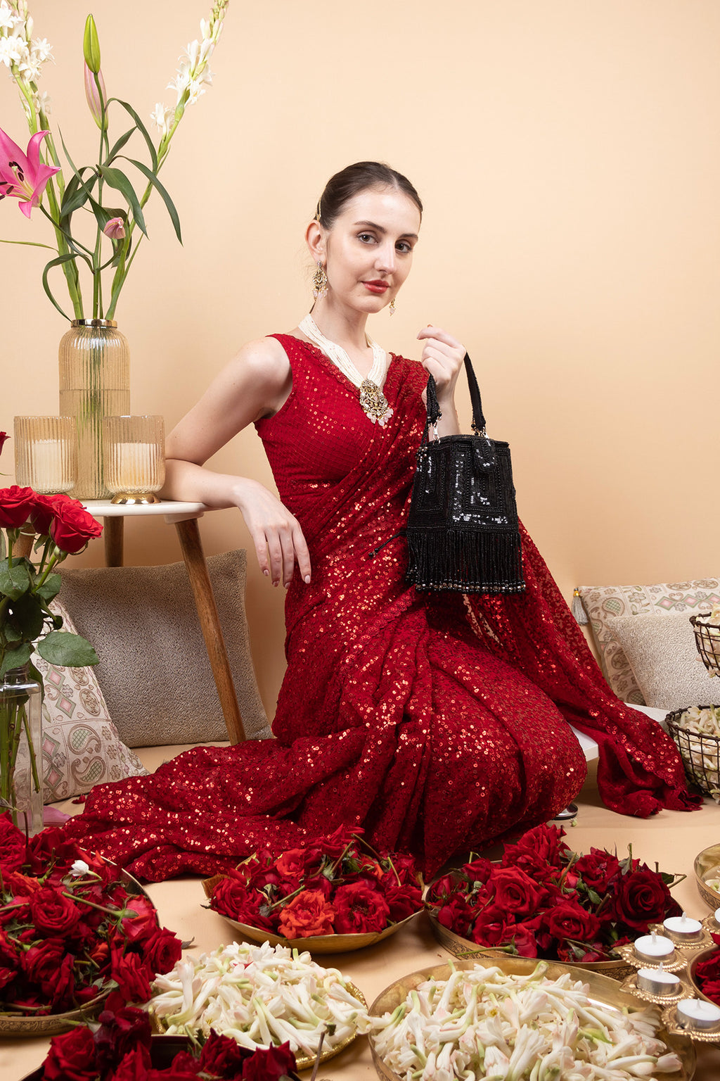Black embellished handcrafted bag with pearl, bead and sequin work with fringe detailing for wedding and party wear