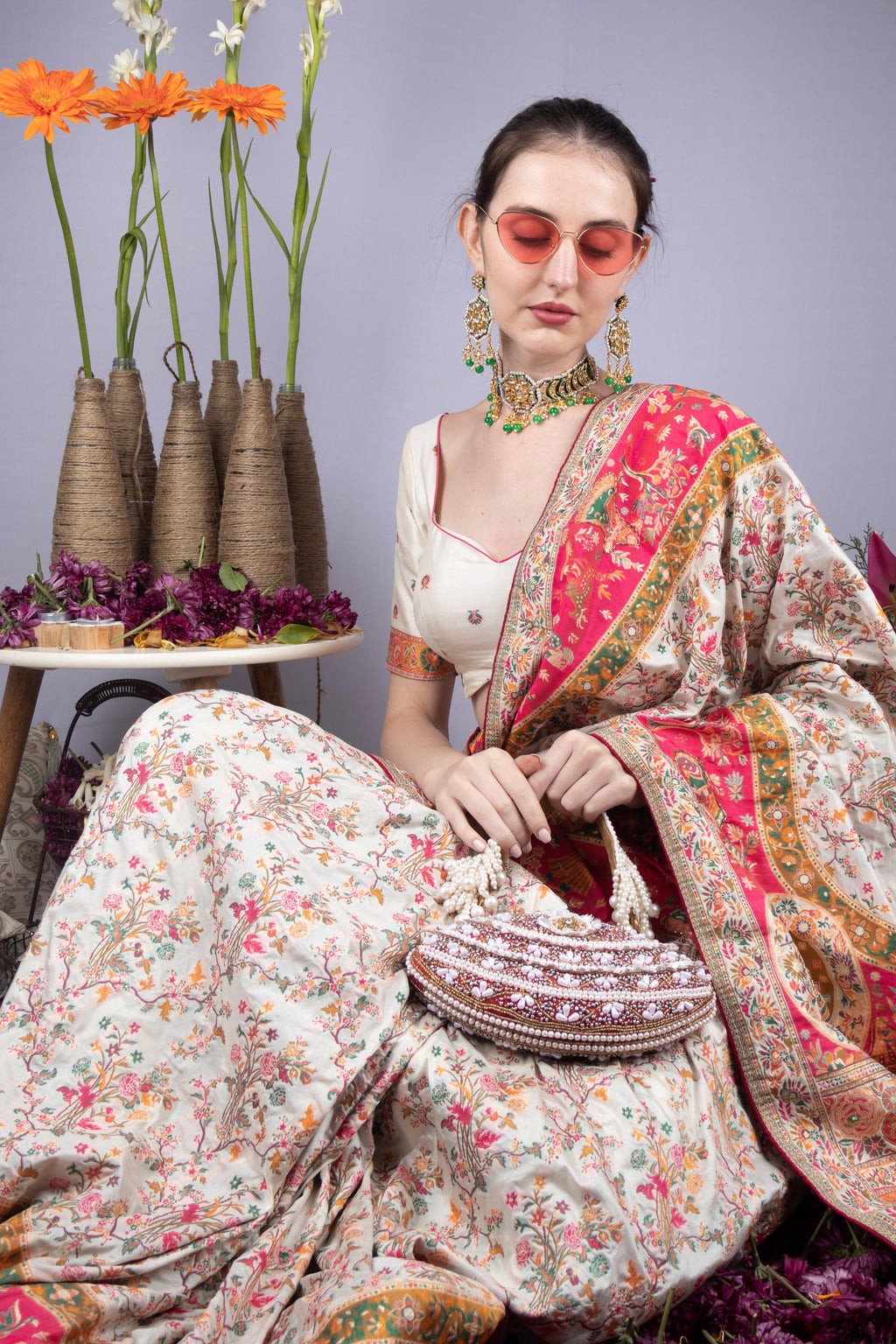 Red and ivory oval clutch with pearl, crystal and cut-dana embellishments with handle for wedding and festive wear