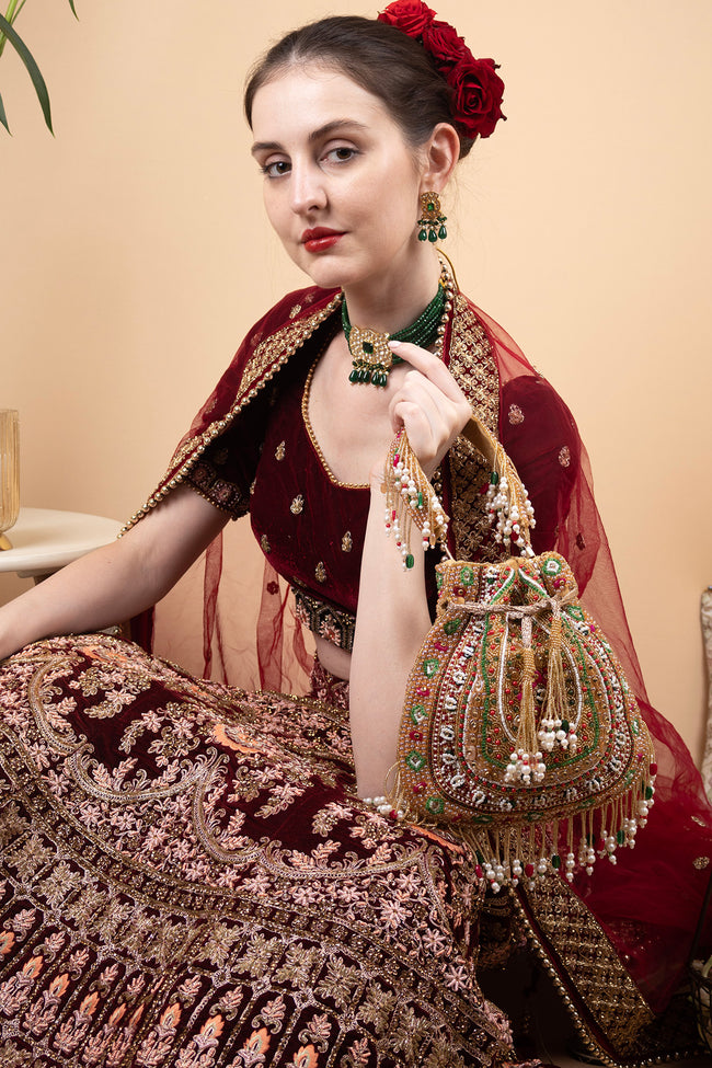 Gold green handcrafted potli bag with beads, stone and pearl work for wedding and festive wear Hover Image