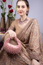 Blush pink pearl and bead embellished ethnic handle bag with suede lining for wedding and festive wear