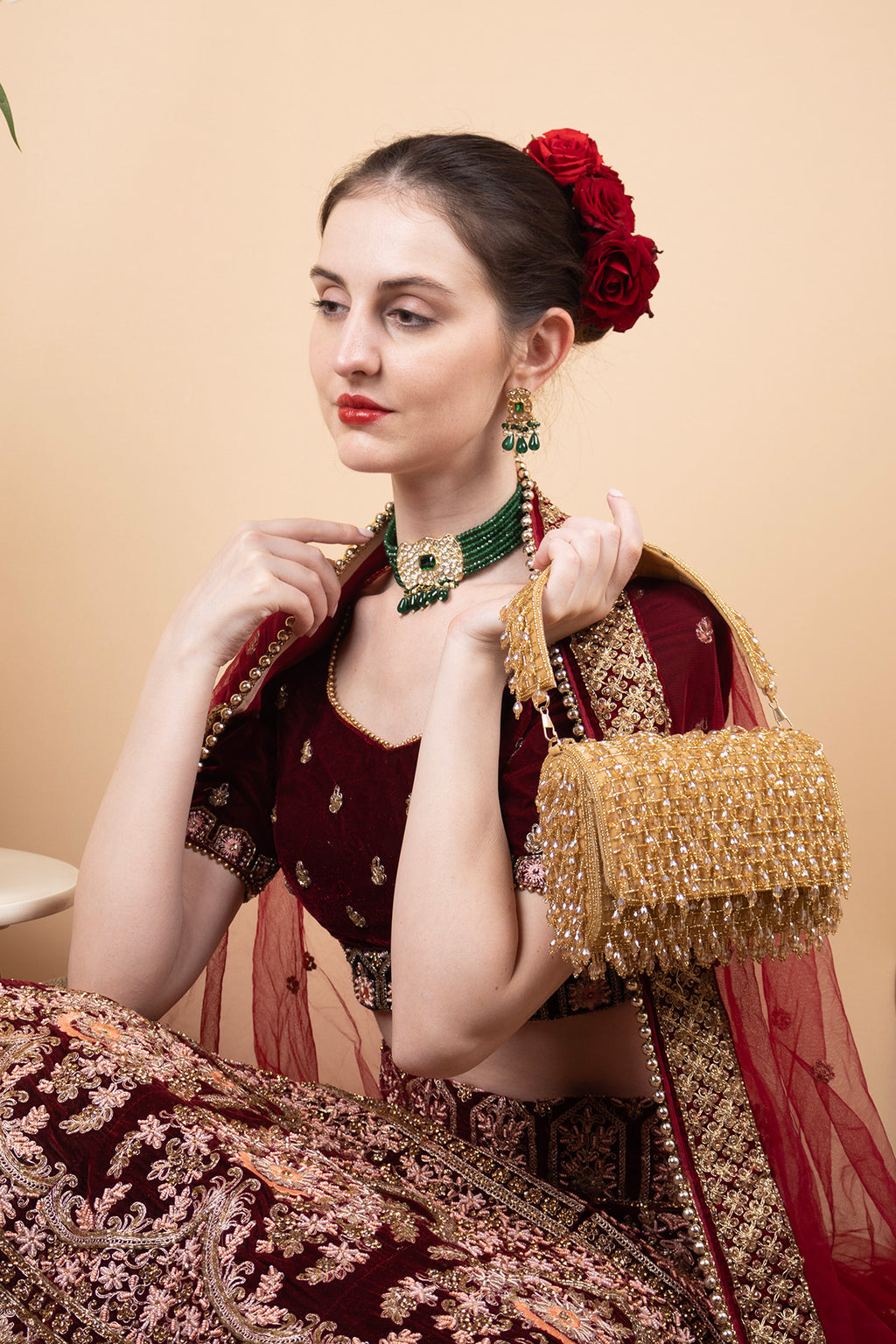 Gold handcrafted clutch with cutdana and crystal embellishments, velvet lining and handle for wedding and party wear