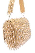 Gold handcrafted clutch with cutdana and crystal embellishments, velvet lining and handle for wedding and party wear