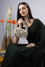 Emerald green handcrafted statement bag with mirror cutdana and sequin embellishments for wedding and festive wear