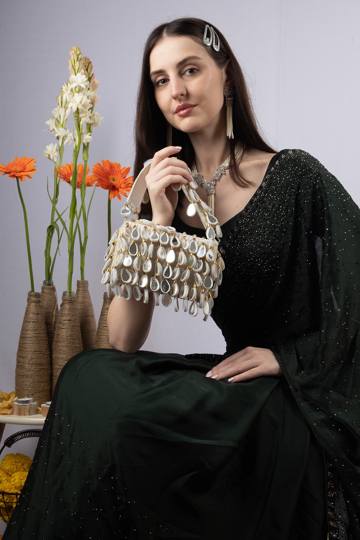 Emerald green handcrafted statement bag with mirror cutdana and sequin embellishments for wedding and festive wear