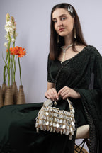 Emerald green handcrafted statement bag with mirror cutdana and sequin embellishments for wedding and festive wear