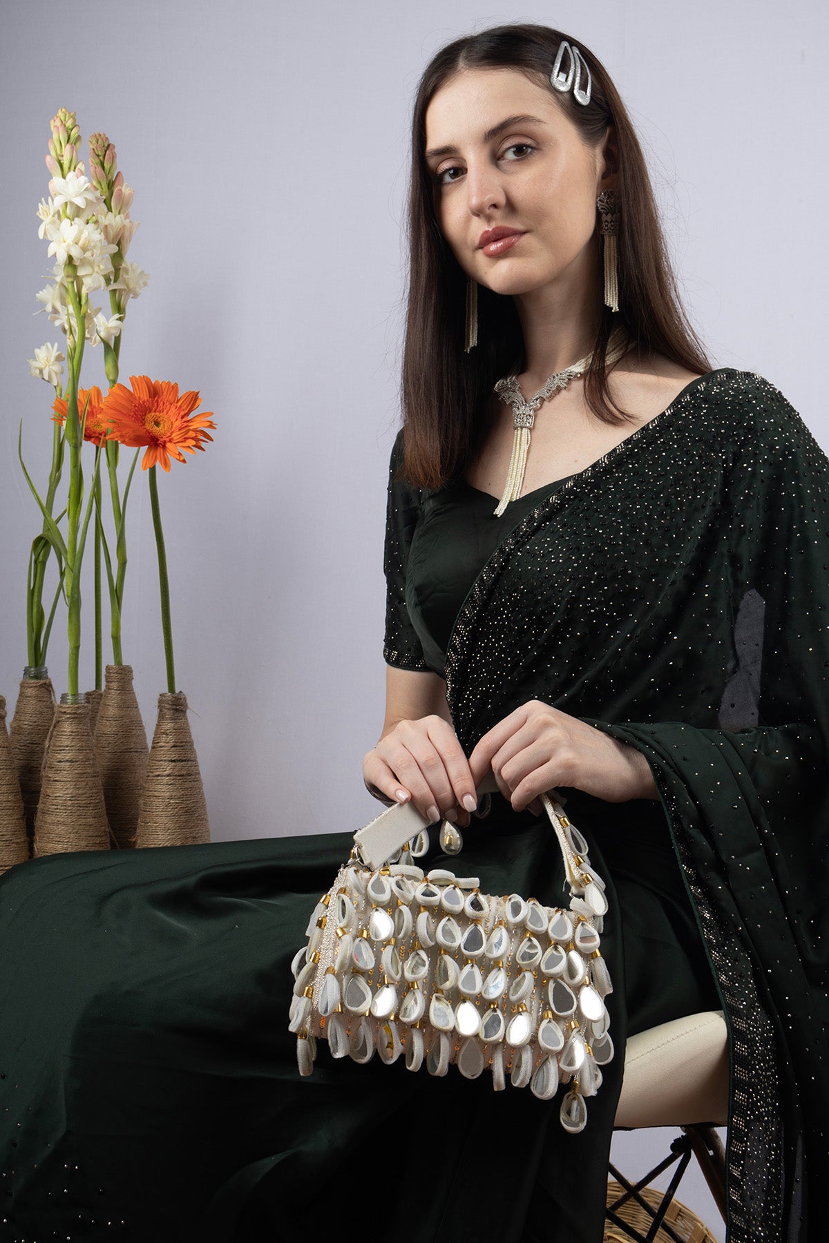 Emerald green handcrafted statement bag with mirror cutdana and sequin embellishments for wedding and festive wear