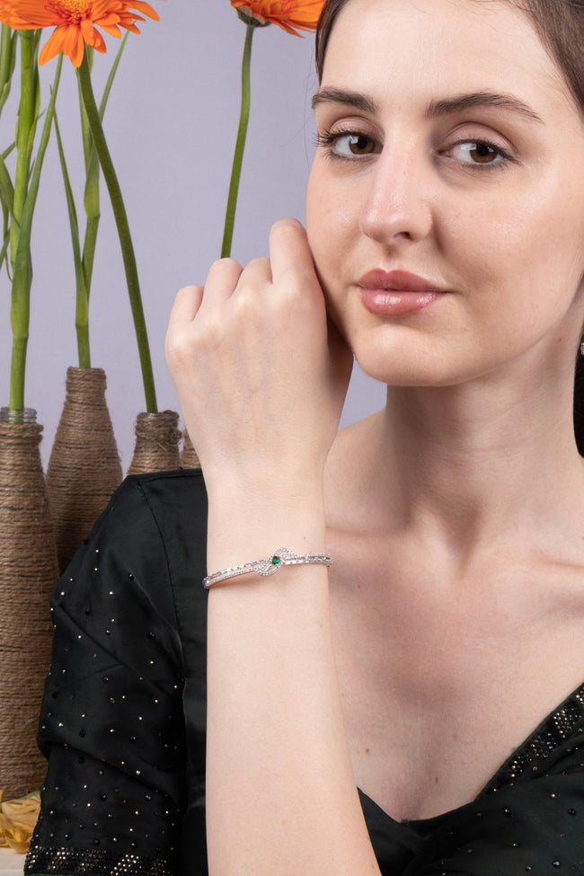 Green CZ Knot Bangle Silver Bracelet Contemporary Occasion Jewellery Hover Image